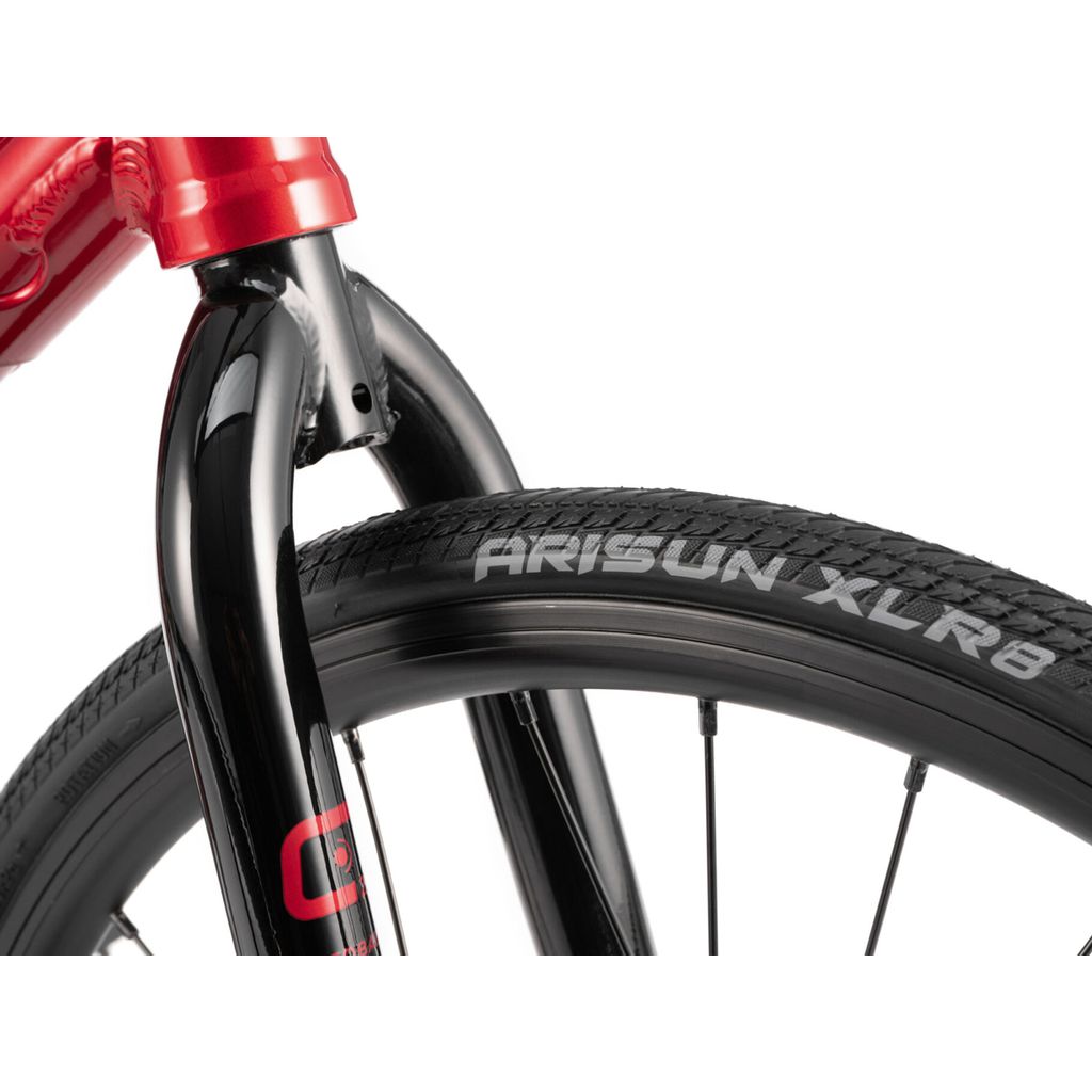 Close-up of a bicycle tire labeled "Radio Cobalt Mini Bike" mounted on a black fork with a red frame, perfect for BMX racing.