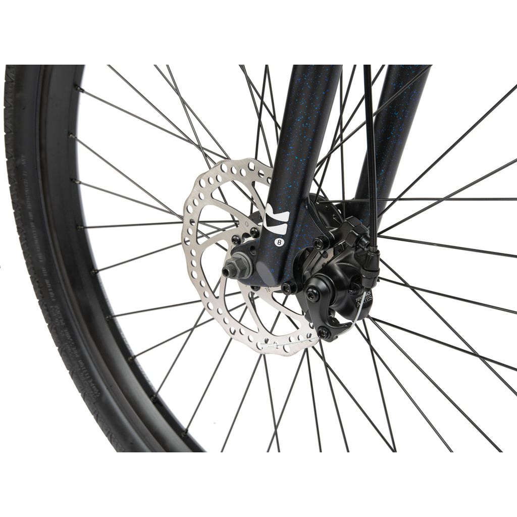 Close-up of a Radio 26 Inch Legion Bike wheel showing the Tektro disc brake mechanism attached to the fork with black spokes.