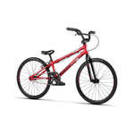 A red BMX race bike with a black seat, black handlebars, and thin tires. The frame and rims flaunt red accents. This Radio Cobalt Junior Bike has a single gear and a rear brake.