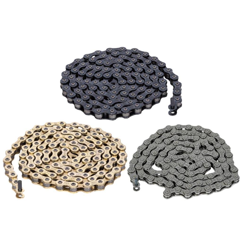 Three coiled bicycle chains, featuring an Eclat Diesel Chain in black, gold, and gray hues, are displayed against a crisp white background.