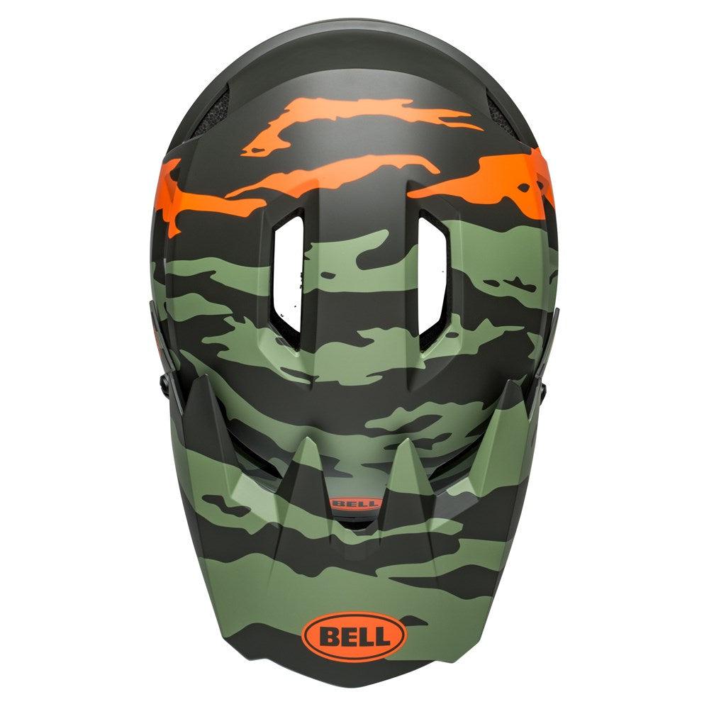 A green and black camouflage-patterned helmet with orange accents, featuring the "BELL" logo on the front. This Bell Sanction 2 DLX MIPS Ravine Matte Green/Orange model offers enhanced protection with MIPS technology and is equipped with Ventilated DH Air padding for maximum comfort.