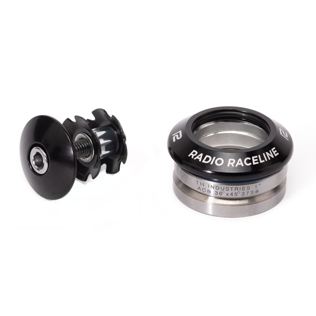 Close-up of a black **Radio Raceline 1-Inch Integrated Headset** assembly featuring a lightweight CNC machined top cap and bolt on the left and high-precision bearings labeled "Radio Raceline" on the right.