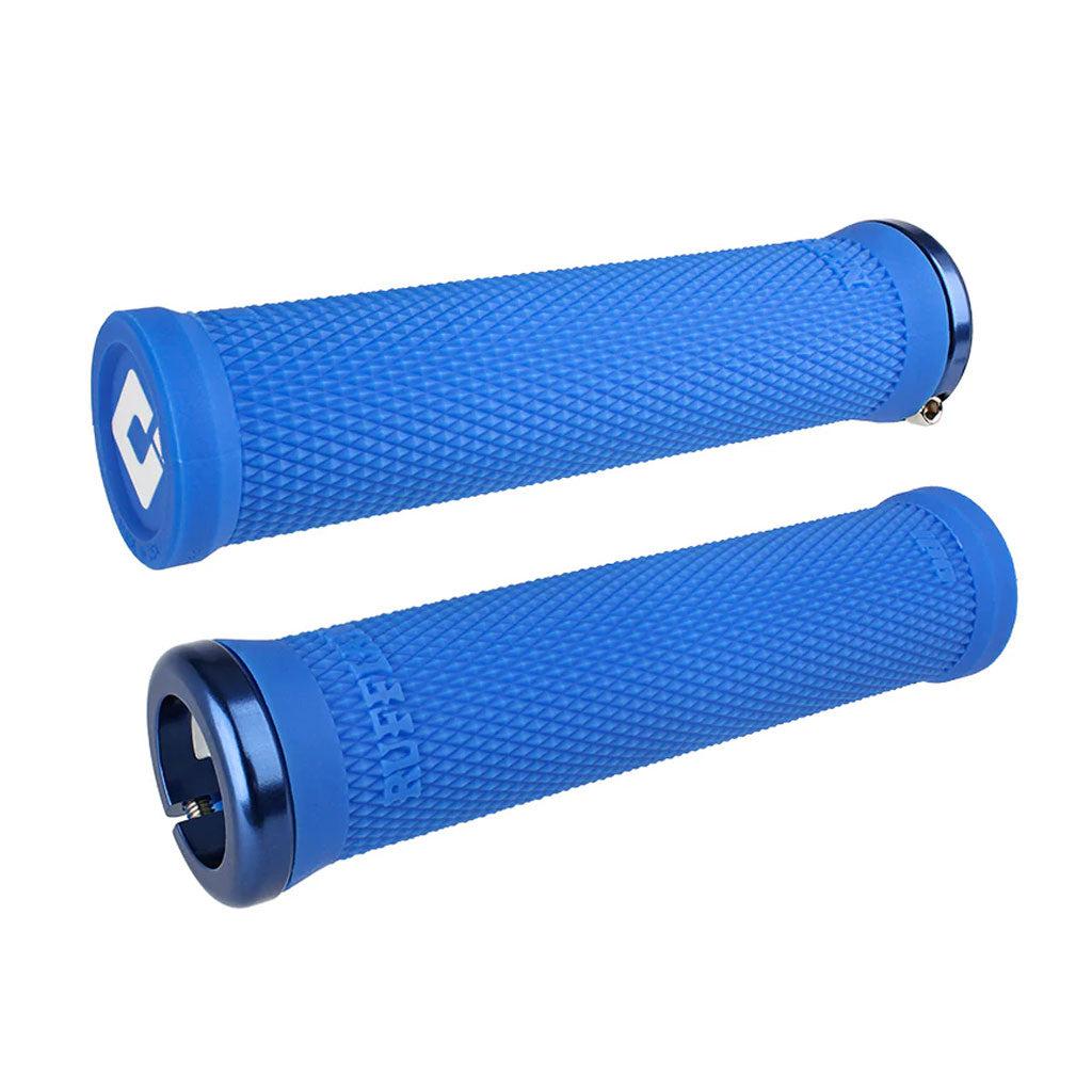 Two ODI BMX Ruffian V2.1 Lock-On grips in blue, each measuring 135mm, with textured surfaces and metal end caps are shown against a white background, featuring the soft compound TPE for enhanced comfort.