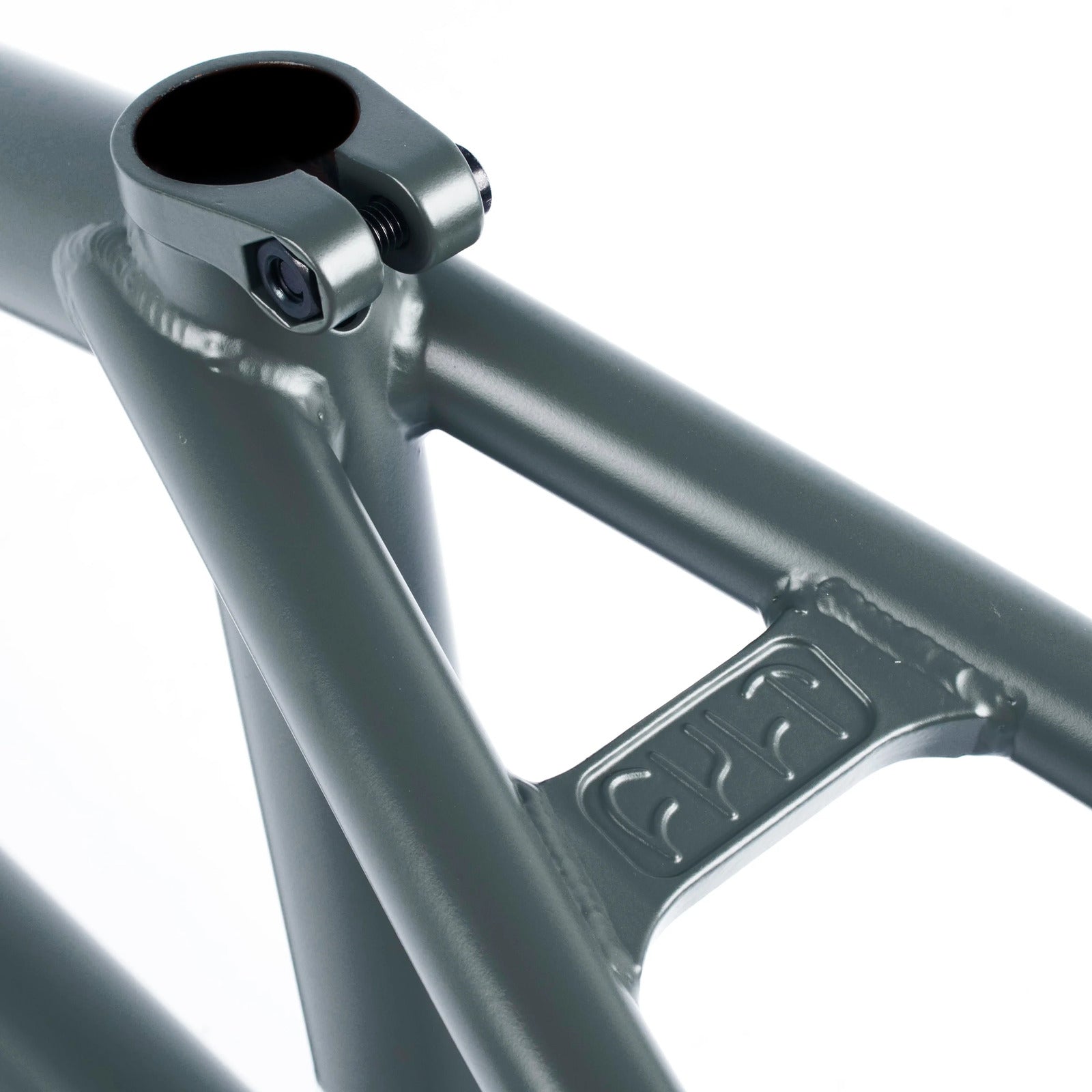 Close-up of the Cult Shorty IC Frame, a gray metal bicycle frame with a clamp and embossed logo on the tube, featuring 100% Cult Classic tubing for durability.