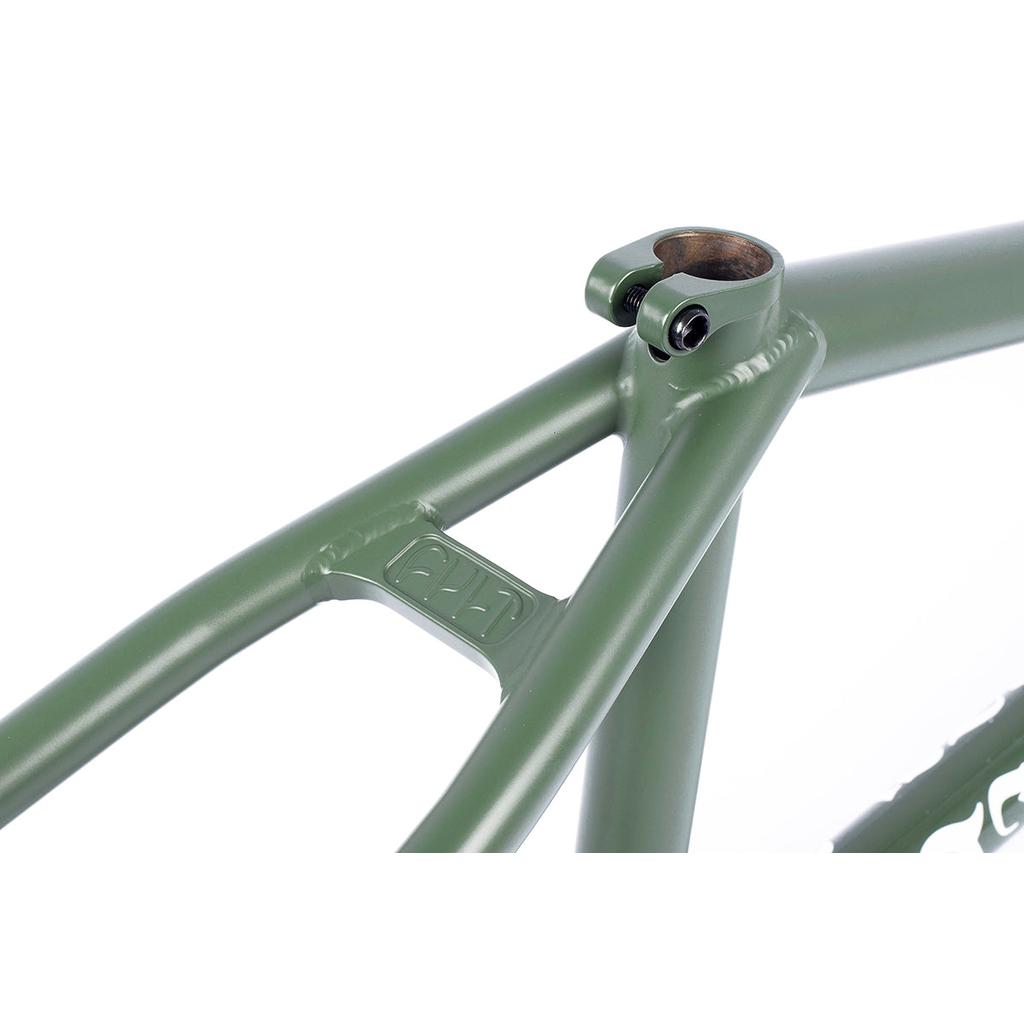 Close-up of an olive green Cult Heavens Gate Frame (Brandon Begin Signature) for technical street riding, highlighting the seat stay junction with a small PLA logo.