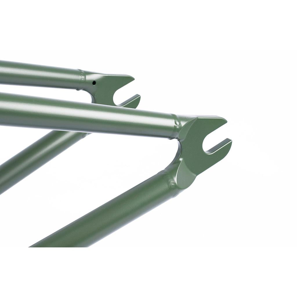 Close-up of the green metal dropouts from the Cult Heavens Gate Frame (Brandon Begin Signature), highlighting the tubing against a plain white background.