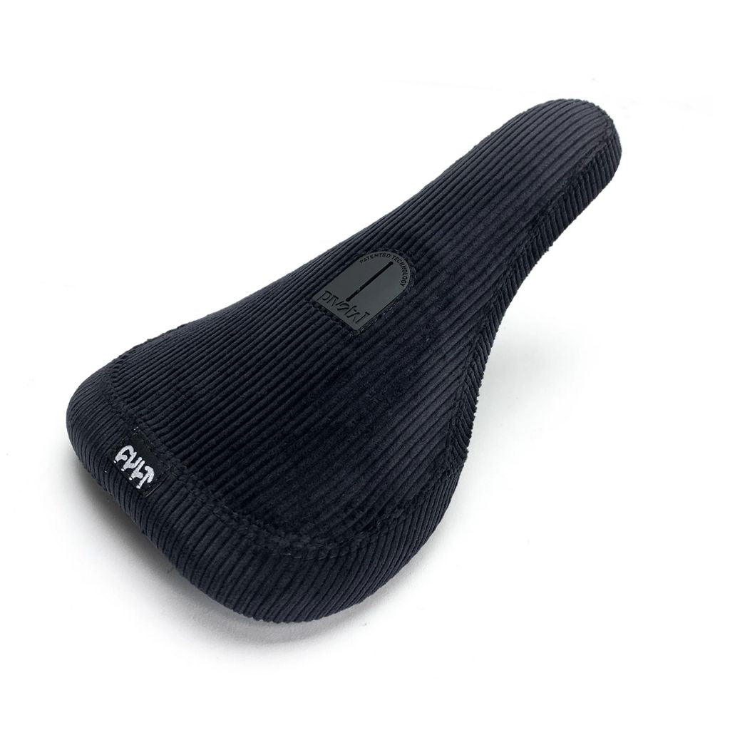 The Cult Corduroy Slim Pivotal Seat showcases a sleek black design with a ribbed texture and includes a small logo on both the front and top—ideal for those who value stylish seats.