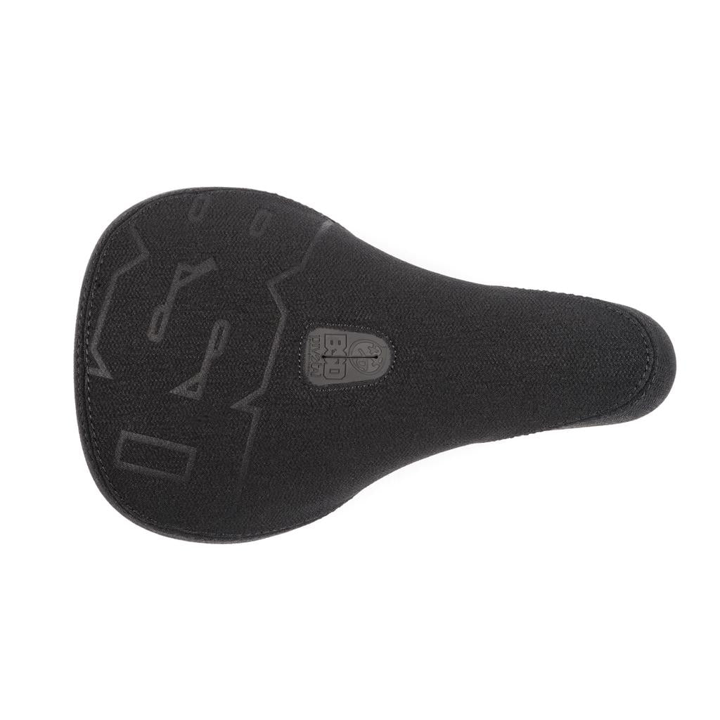 The BSD Mondo Logo Pivotal Seat is a black BMX bike seat with embossed designs and an outline logo, viewed from above. It features durable Kevlar construction, making it ideal for riders looking for both style and strength.