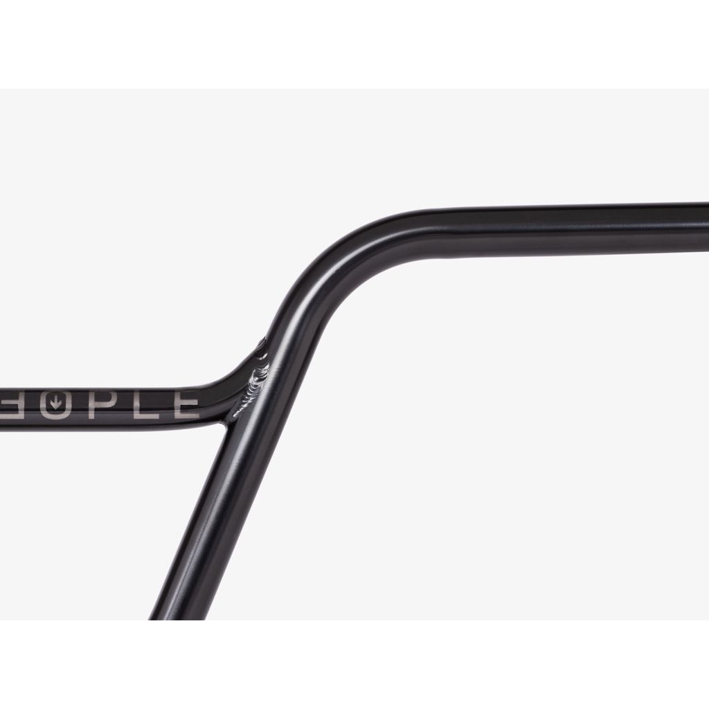 Close-up of a sleek Wethepeople Utopia Handlebar with "Wethepeople" partially visible, showcasing a smooth, glossy finish against a white background.