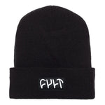 The Cult Witness Tight Knit Beanie is a black beanie with a folded cuff, crafted from hypoallergenic acrylic and featuring the word "CULT" embroidered in white on the front.