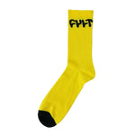 Cult Logo Socks in a unisex design showcase a striking yellow color with black toe and heel accents and "FUT" boldly printed near the top, epitomizing modern cult fashion.