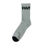 Introducing the Cult Logo Socks, a unisex white pair adorned with "CULT" in bold black letters at the top and finished with a stylish black toe, available in one size.