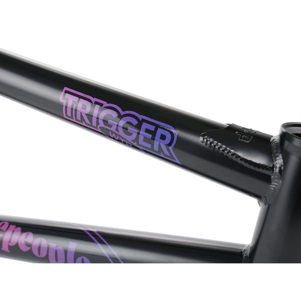 Close-up of a black Wethepeople Trigger Frame featuring "TRIGGER" in white and purple letters, highlighting its durable construction for enhanced performance.