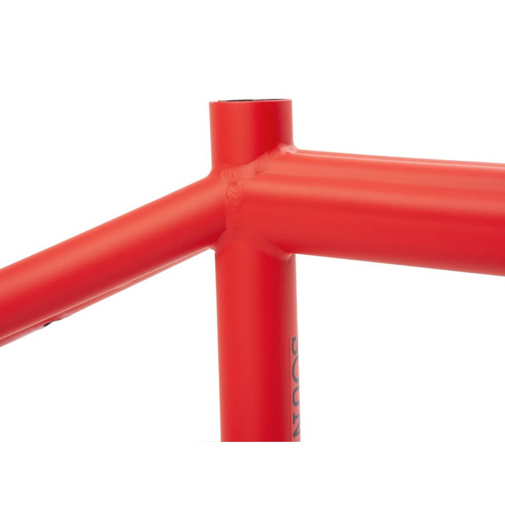 Close-up view of the welded joints on a red Sunday Soundwave V3 Frame, showcasing its lightweight and strong build.