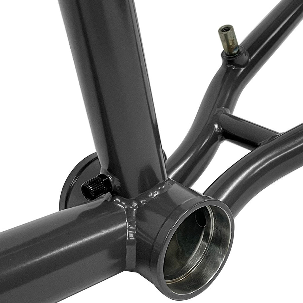 Close-up of the S&M C.C.R. 14mm Dropout Frame, showcasing intricate welds and dual-opening bottom bracket shell. Painted glossy gray, this frame embodies Clint Reynolds' signature precision in a sleek design.