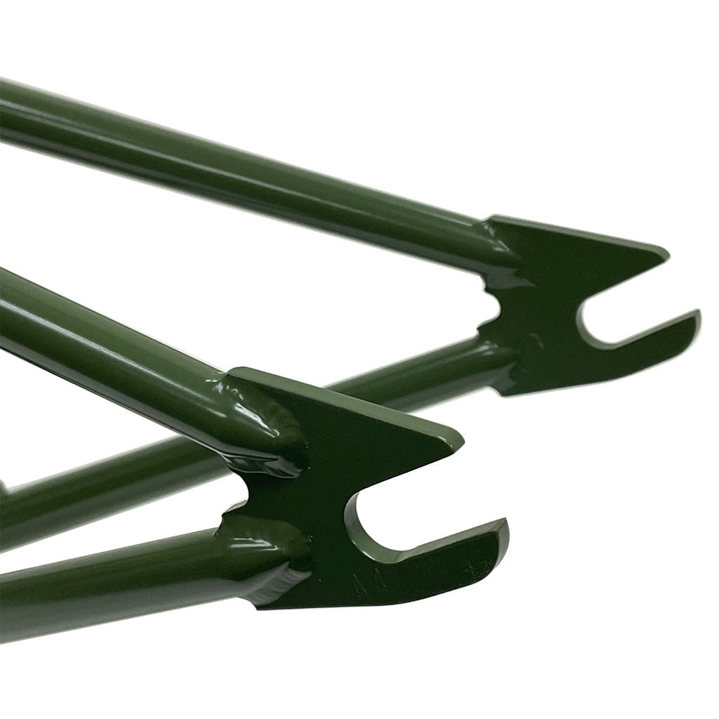 Close-up of green metal dropouts with open slots for 14mm wheel axles on the S&M C.C.R. (Clint Reynolds) 14mm Dropout Frame, inspired by Clint Reynolds' signature style.