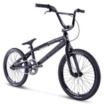 The Chase Element Pro L Bike is a black BMX bike with a sleek design, featuring thick tires, a sturdy frame, and a raised handlebar. This model includes Ikon carbon forks for enhanced performance, as well as a chain guard and foot pegs on both the front and rear wheels.