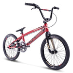 The Chase Element Pro L Bike features a red BMX frame with black handlebars and seat, a sleek frame design, thick black tires, Chase Element chain-driven pedals, and Ikon carbon forks.