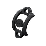 The Magura MT-C Clamp is a replacement component for the brake lever, featuring a curved black plastic design with a central circular logo and two large holes on either side.