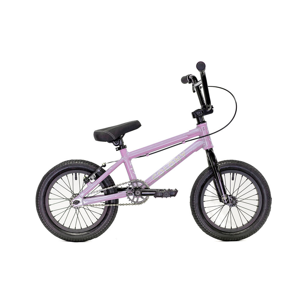 Introducing the Colony Horizon 14 Inch Bike: a compact, purple children's bicycle designed with black handlebars and seat. It features a lightweight alloy frame, complemented by a black front fork and pedals, all inspired by BMX bikes.