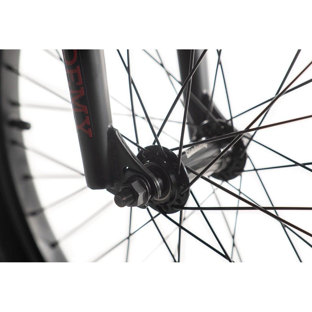 Close-up image of a bicycle front wheel highlighting the spoke details and hub mechanism of the Academy Desire 20 Inch Bike.