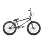 The Academy Aspire 20 Inch Bike features a black freestyle BMX design with thick tires, a small seat, CrMo bars, and the "Academy" logo prominently displayed on the frame.