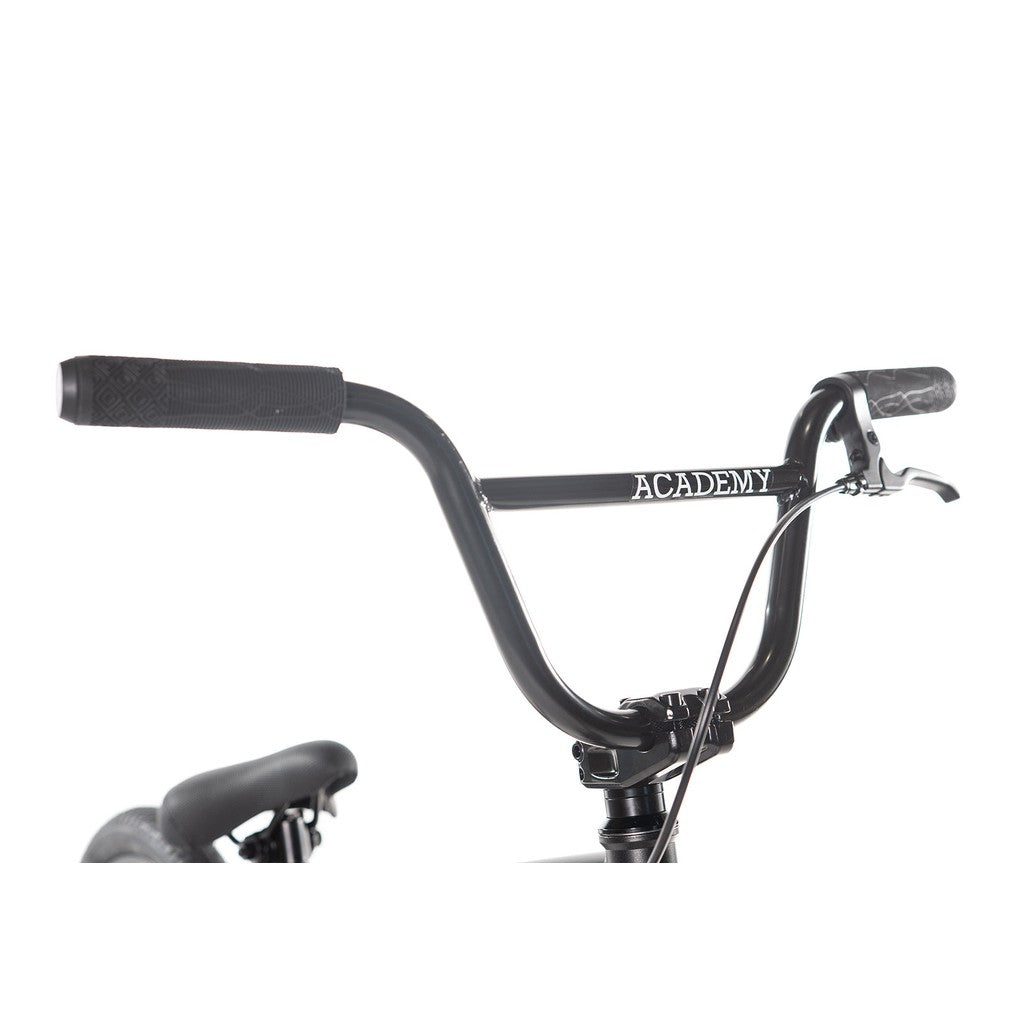 Handlebars with black grips and a brake lever, featuring the word "ACADEMY" printed on the crossbar, ideal for BMX bikes like the Academy Inspire 16 Inch Bike with their sturdy sealed hubs.