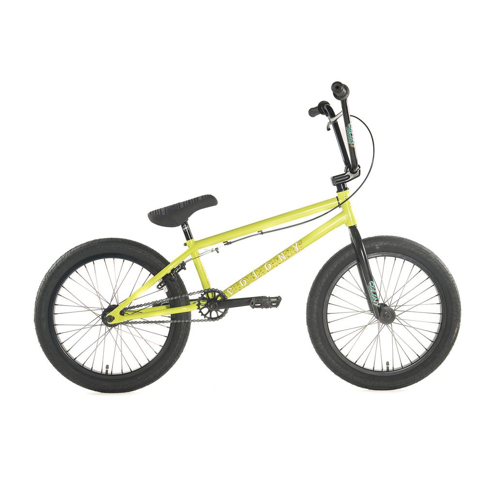 The limited edition Colony Rico Pro 20 Inch Bike features a sleek yellow frame with black handlebars, seat, wheels, and pedals. It boasts thick tires and is showcased against a simple white background.