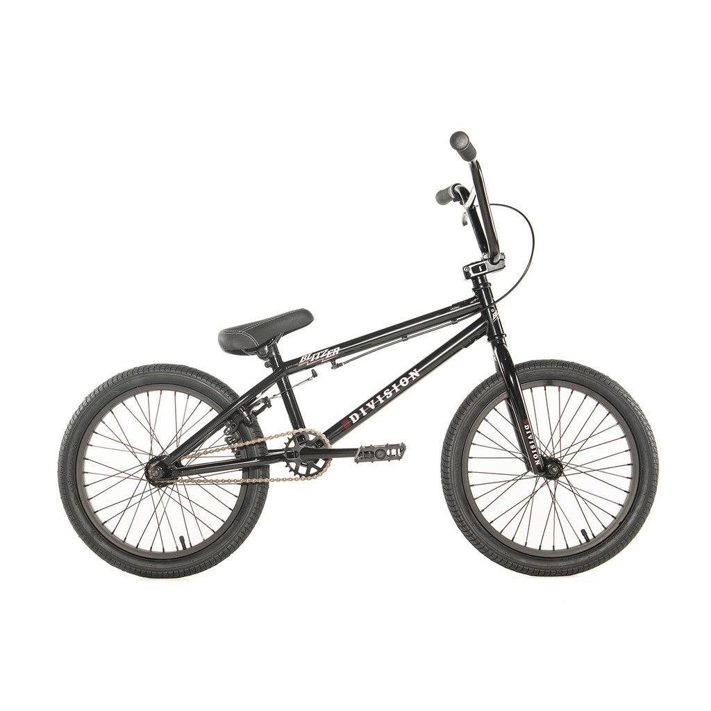 The Division Blitzer 16 Inch Bike is an entry-level BMX bike that features thick tires, a sturdy frame, and straight handlebars, making it perfect for newcomers to the sport. This black bicycle is displayed from the side against a white background.