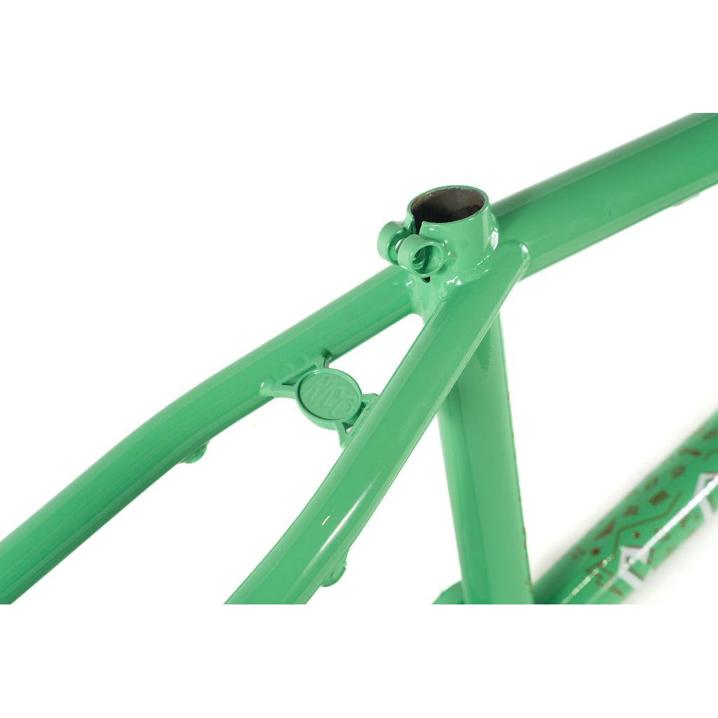 Close-up of the green Colony Rico 'Lite' Frame highlighting the rear triangle and seat tube joint, with a logo on one of the tubes.