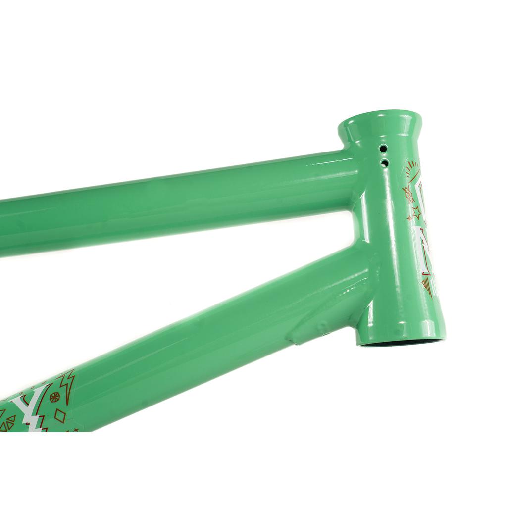 Close-up of a Colony Rico 'Lite' Frame in green, featuring geometric patterns near the head tube.