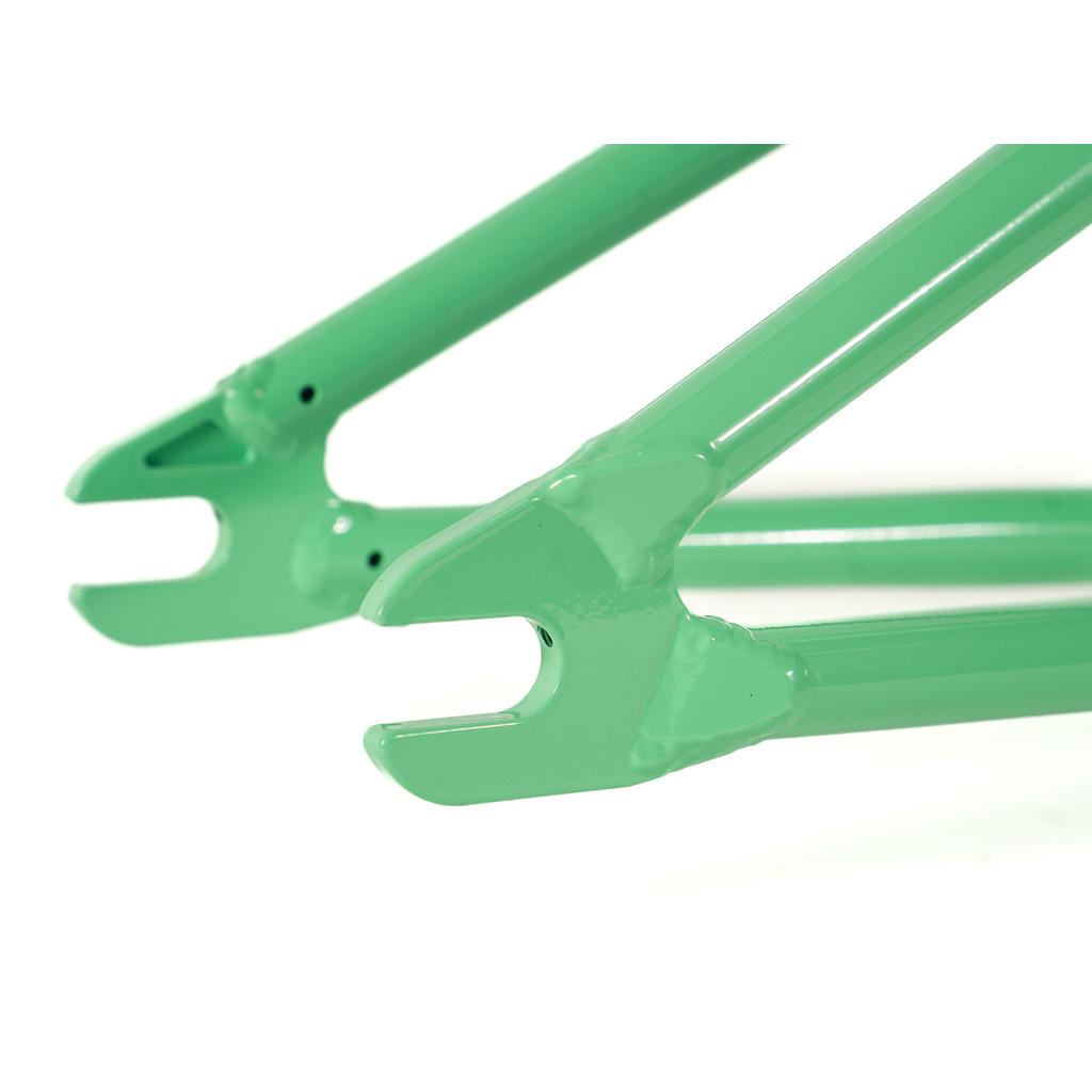 Close-up of green Colony Rico 'Lite' Frame rear dropouts showing the frame's attachment points for the wheel axles.