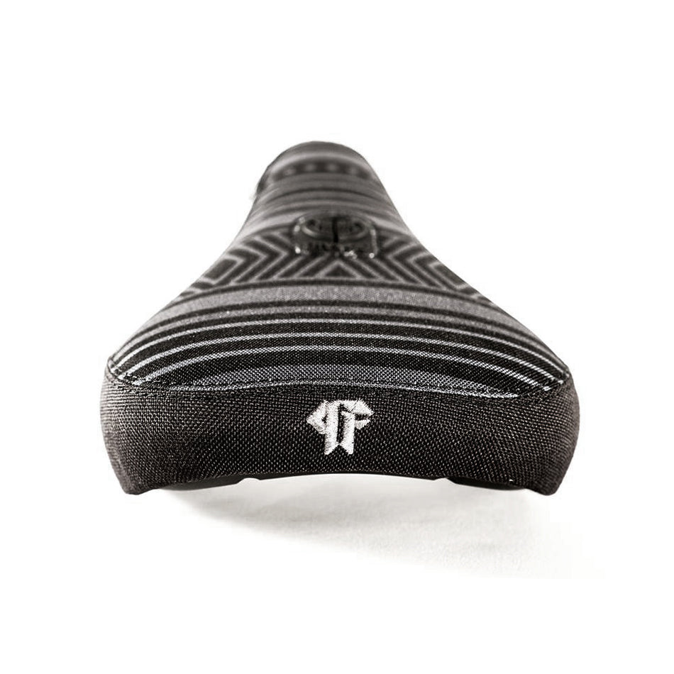 Close-up of the Colony Paterico Pivotal Seat, showcasing its black design with striped patterns and an embroidered logo at the rear.