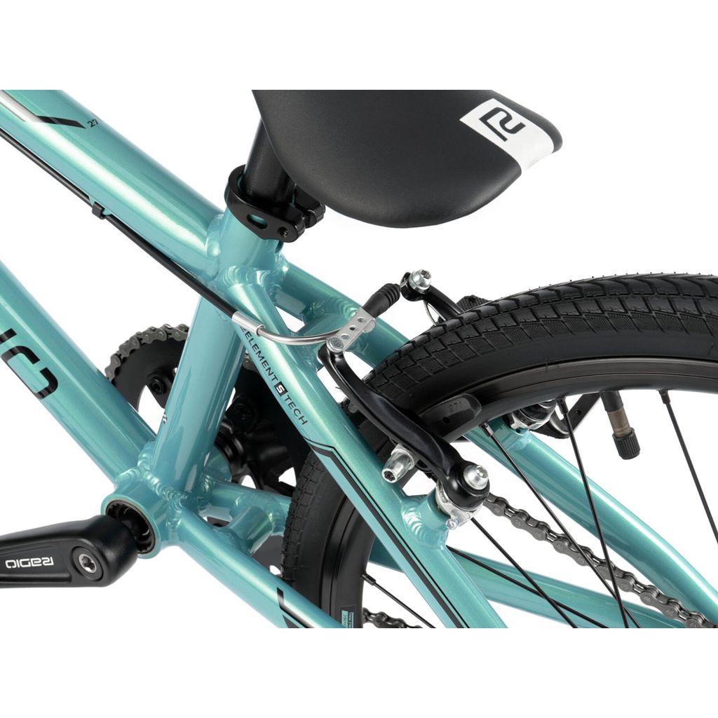 Close-up of a teal bicycle's rear section, focusing on the brake system, wheel, and part of the saddle. This entry level Radio Cobalt Expert Bike offers excellent balance and durability for new riders.