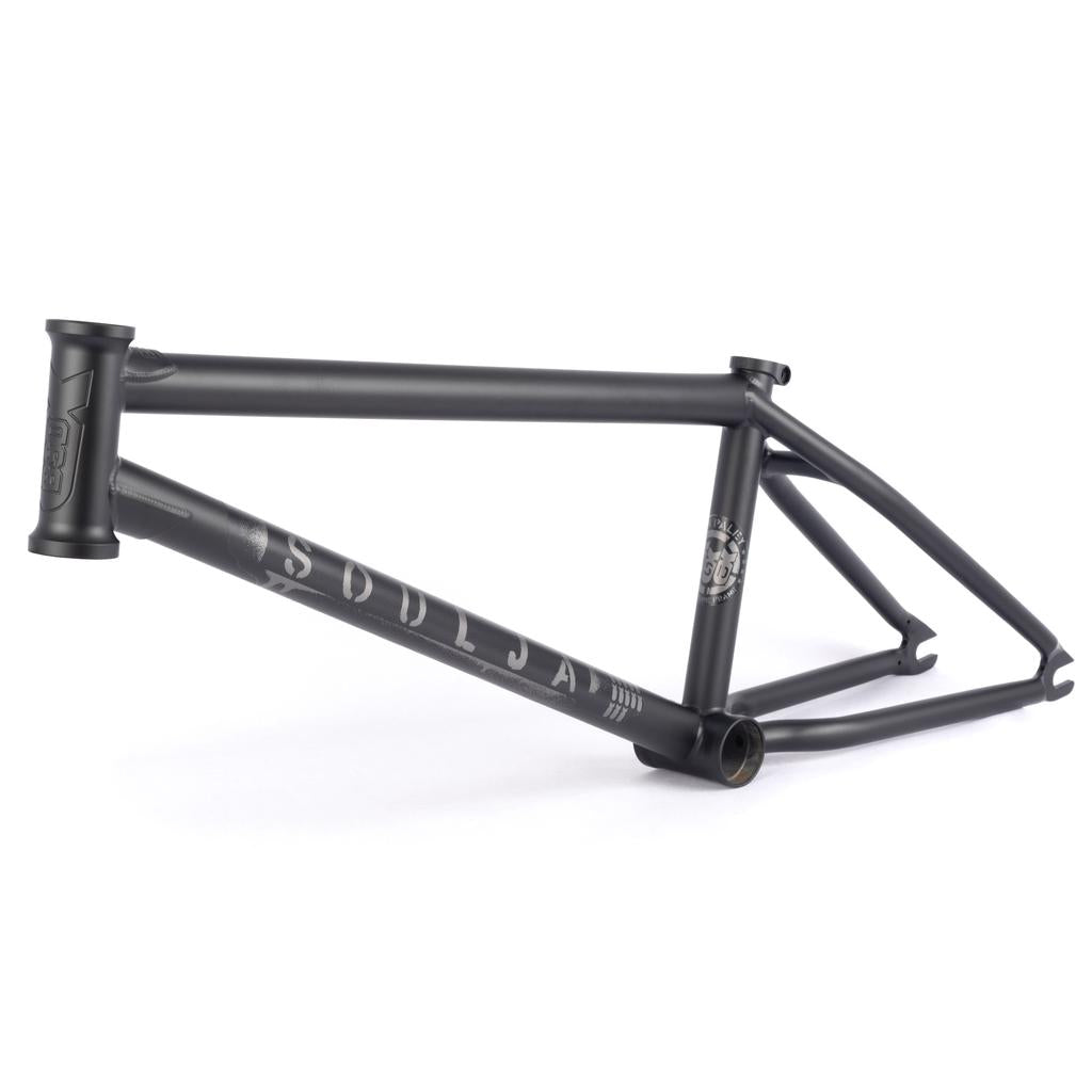 The 2022 BSD Soulja V4 Frame in matte black boasts "Soldja" branding on the downtube and seat tube graphics. Its SuperScoop chainstays and invest cast dropouts ensure a BMX bike that excels in style and performance.