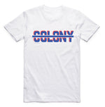 Introducing the Colony Strikethrough T-Shirt: this regular fit tee in white showcases "COLONY" in striking bold red and blue colors, artistically crossed by a sleek blue line. Made from soft carded cotton, it combines comfort and style effortlessly.