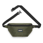 Introducing the Colony Practicality Sack: a green waist bag with an adjustable black strap and buckle. It features a small front zipper pocket and a logo patch for added style.