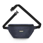 A dark blue waist bag with a black adjustable strap and buckle, featuring a label on the front that reads "Colony Practicality Sack.