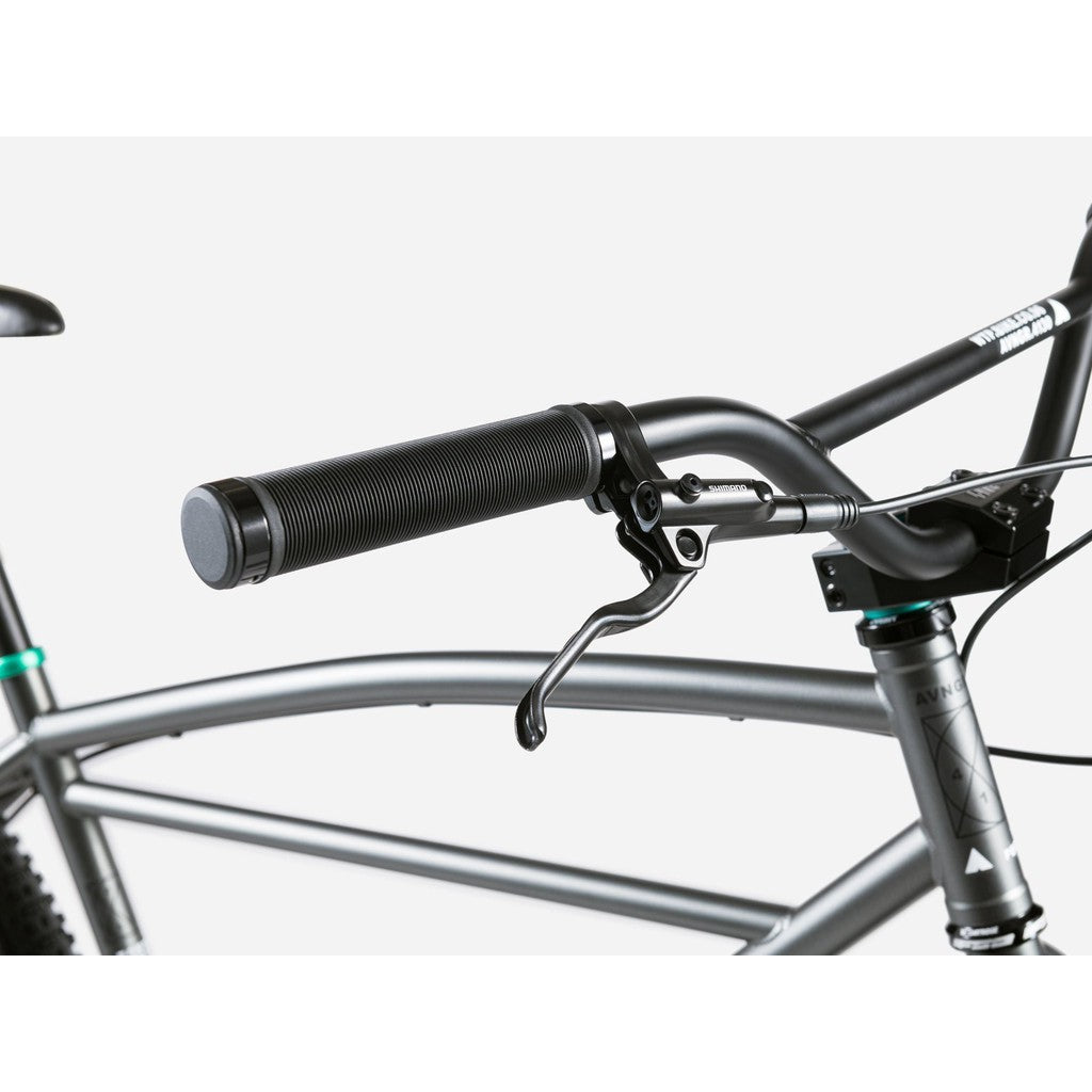 Close-up of a bicycle's handlebars and brake lever on a sleek Wethepeople Avenger 27.5 Inch Bike frame against a white background, featuring modern disc brakes for precision stopping power.