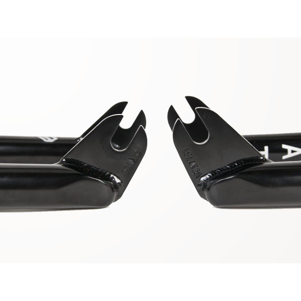 Close-up of two black metal bicycle dropouts, echoing the Eclat Storm Fork's robust design, positioned facing each other on a white background.