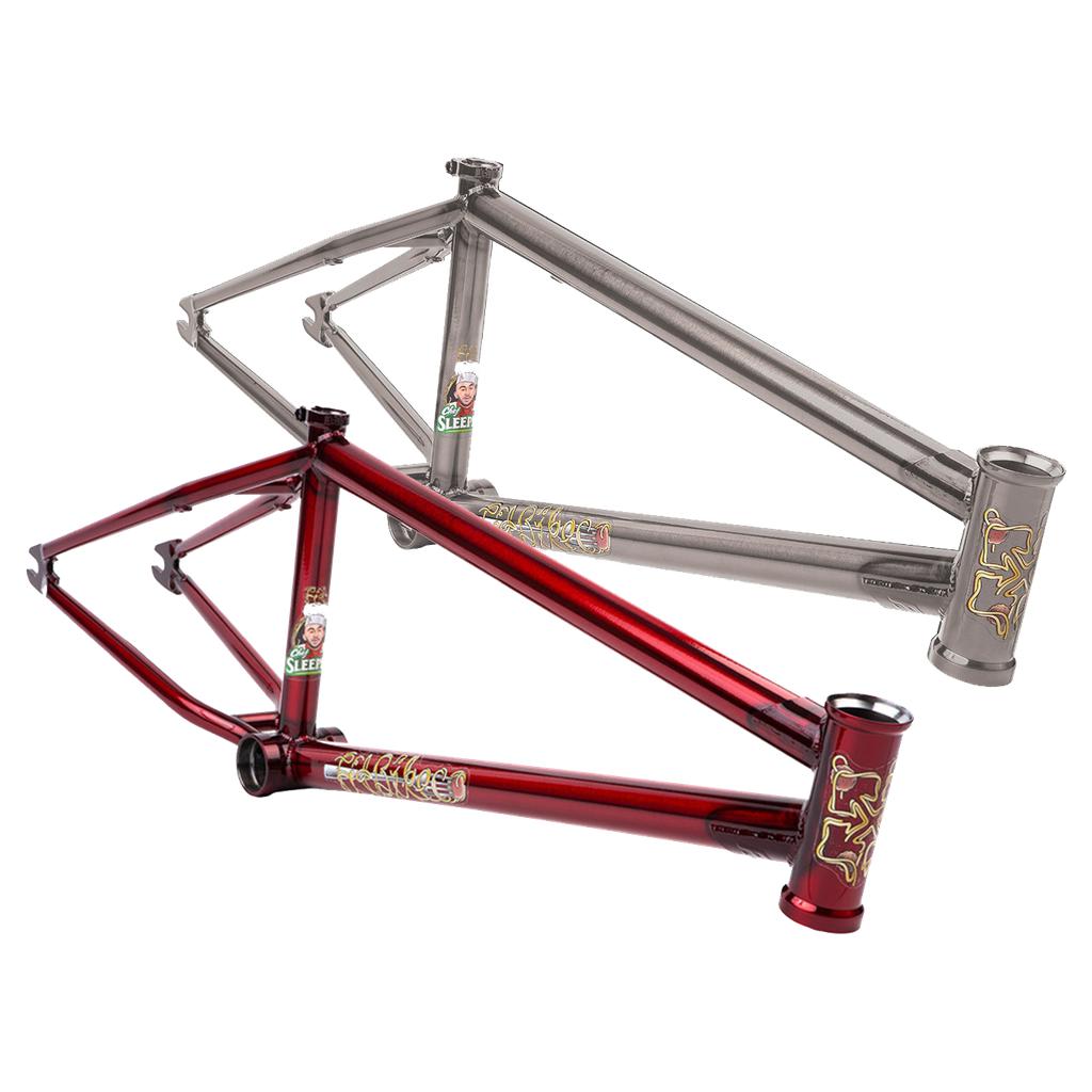 Two BMX bike frames are shown: a metallic silver Fit Bike Co Sleeper (Ethan Corriere) frame with super responsive geometry for agile riding, and a glossy red one. Each features decals on the head tube and seat tube, reminiscent of pro rider Ethan Corriere's designs.