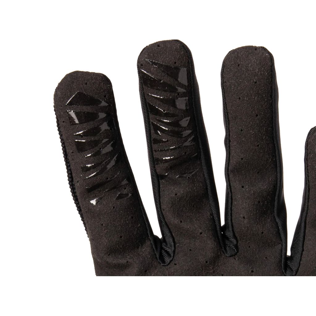 Close-up of a Fuse Alpha Youth Glove's black fingers highlighting textured silicone grips and a reinforced thumb area for enhanced durability.