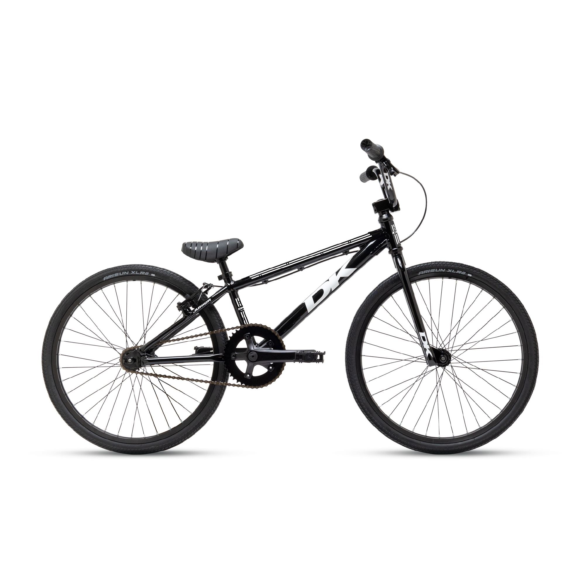 The DK Swift Junior Bike boasts a black and white design with a lightweight aluminum frame, straight handlebars, and knobby tires, all showcased on a pristine white background.