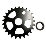 The DRS Steel Front Sprocket, available in black and featuring four cut-out sections along with various teeth options, is paired with a small black ring positioned beside it.