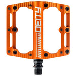 The Deity Black Kat Pedals boast a striking orange design, featuring DEITY's signature rectangular shape and multiple grip pins for optimal traction.