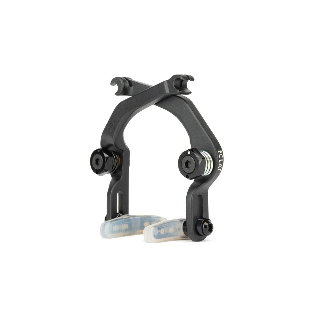 The Eclat Device U-Brake, with its sleek black design and Éclat brake pads, is complemented by durable metal hardware on a crisp white backdrop.