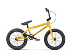 The Wethepeople Seed 16 Inch Bike showcases bold "WETHEPEOPLE" branding on its frame, featuring thick black tires and Salt Rookie Tubular Chromoly Cranks. Displayed from the side against a pristine white background, this vibrant yellow BMX shredder is a visual standout.