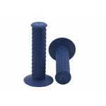 The Kastan Grips, featuring two blue rubber handles with their signature grip patterns, showcase era-appropriate rubber design with one standing upright and the other resting on its side.