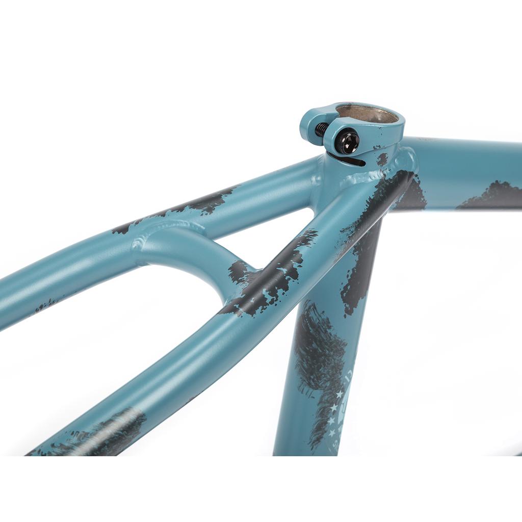 Close-up of a 2021 BSD Soulja V4 Frame in blue with black abstract patterns, highlighting the top tube, seat tube, and clamping mechanism with bolt.