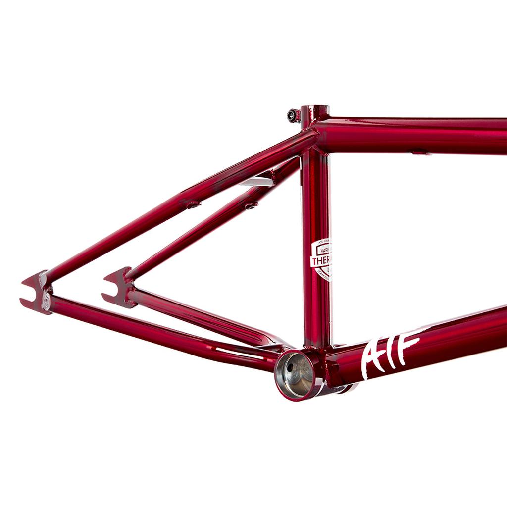 The S&M ATF 20 Inch Frame, crafted with chromoly construction and BMX geometry, is presented in a glossy red finish. It features logos and is displayed without wheels or other components, offering a sleek and modern look.